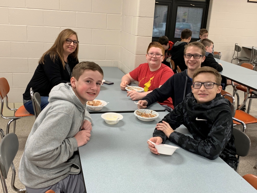 students at tables with bowls of ice cream